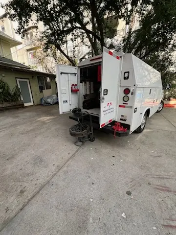 Magnet Plumbing service vehicle on-site for Grease Trap Cleaning in Huntington Harbour